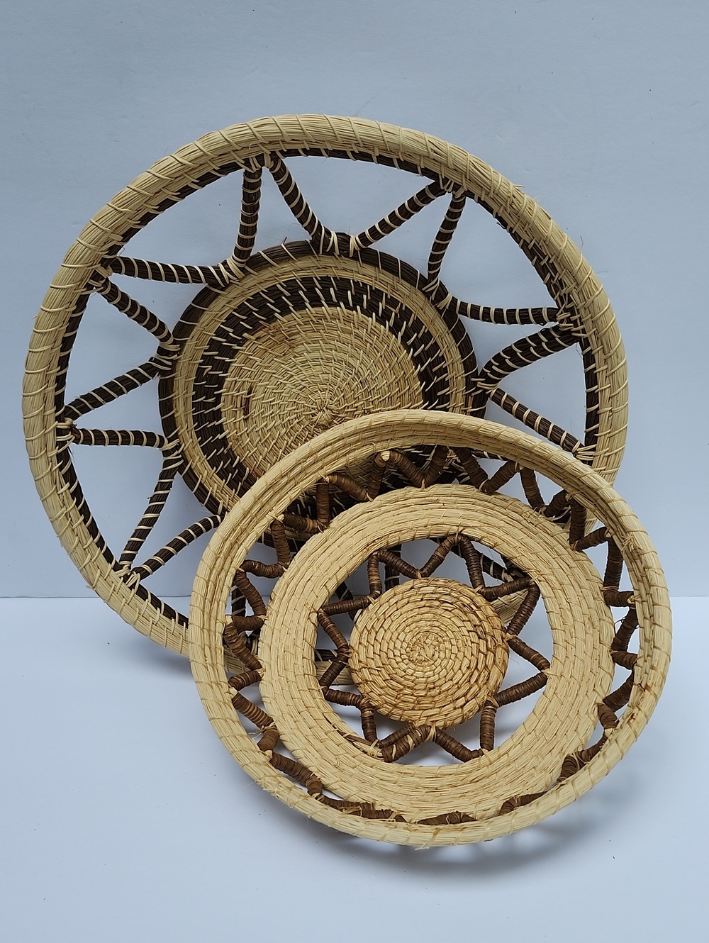 A SET OF 2 HANDWOVEN NATURAL FIBER BASKETS